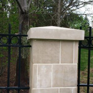 Photo of concrete fence pillar that has been recently cleaned