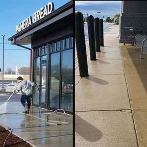 Photo of Powerhouse Pete power washing and restoring concrete for a commercial storefront