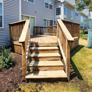 Photo of a wood deck after being soft power washed and restored