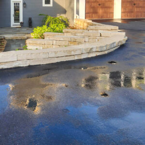 Photo of a driveway and brick pavers after being power washed