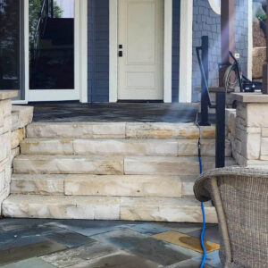 Photo of a brick paver stair in front of a home after a power washing